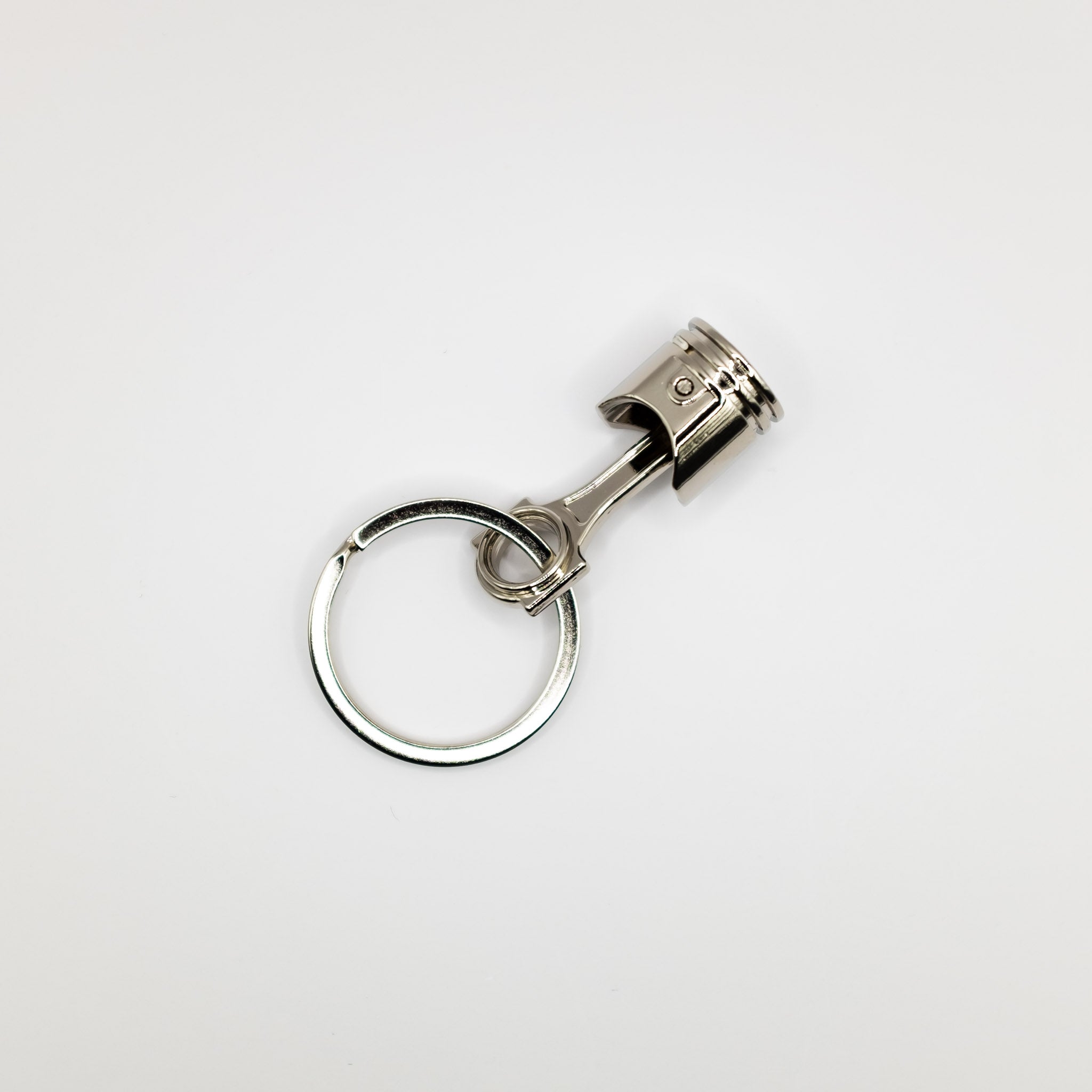 Piston clearance key ring